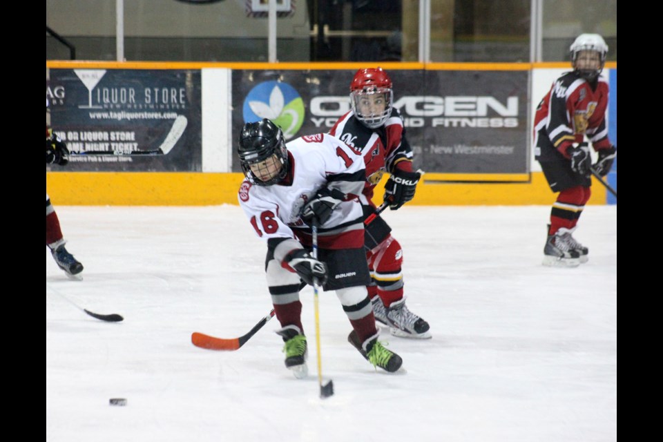 02-16-2014 Burnaby Minor (white) vs. New west, peewee c3 photo Jason Lang