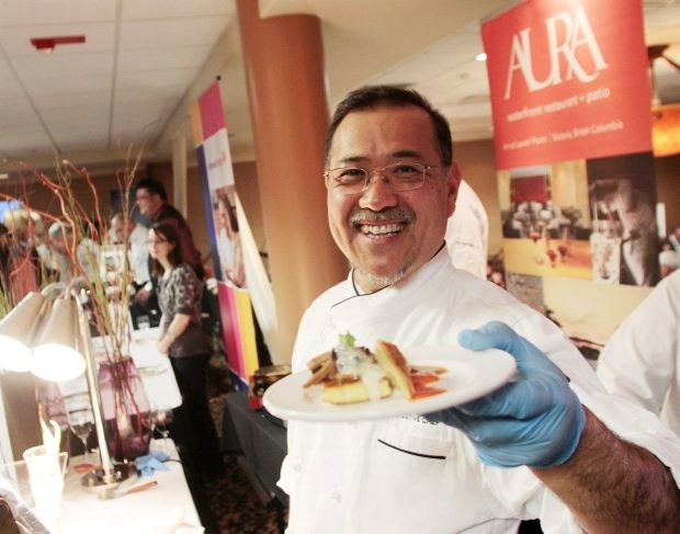 Chef Takashi Ito serves up a dainty dish at the Dine Around & Stay in Town Victoria opening at Aurara on Friday.