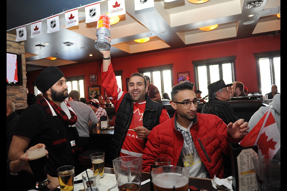 The Shark Club Bar and Grill was packed with Canadian hockey fans Friday morning who cheered on their team to a 1-0 win over the Americans in men's Olympic semifinal hockey action. Team Canada now faces Sweden Sunday morning in hopes of repeating a gold-medal win. Photo by: Rebecca Blissett