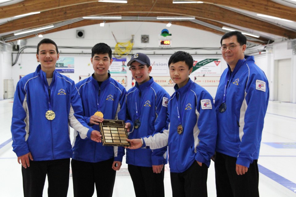 Zone 4 won gold in curling at the B.C. Winter Games. From left to right: third Tyler Proctor, 16, second Breyden Chong, 16, skip Brayden Carpenter, 15, and lead Horace Mak, 14, and coach Len Chong,