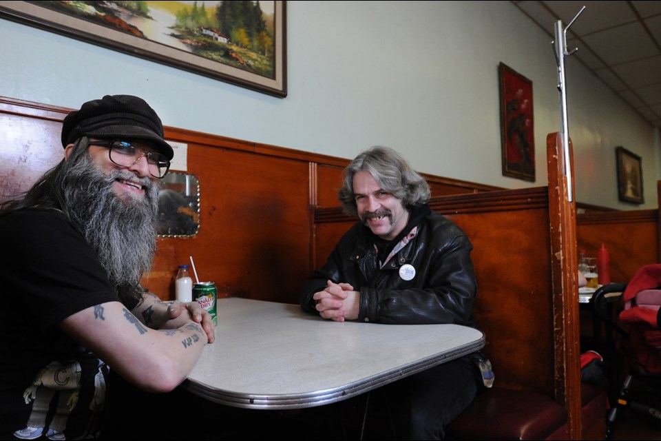 Ovaltine spirit: In the latest instalment of our Vancouver Special neighbourhood series, the Courier visits the Downtown Eastside, home of the Ovaltine Café where Bernie Pleskach (l) and John Turgeon enjoy a laugh. Photo Dan Toulgoet