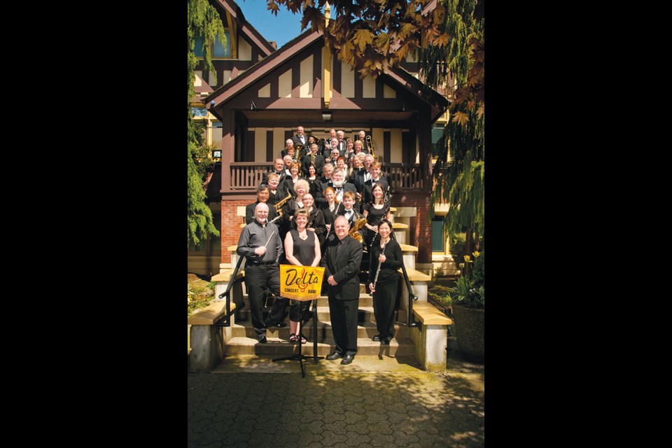 The Delta Concert Band pictured on the steps of the Delta Museum is celebrating its 50th anniversary of making music.