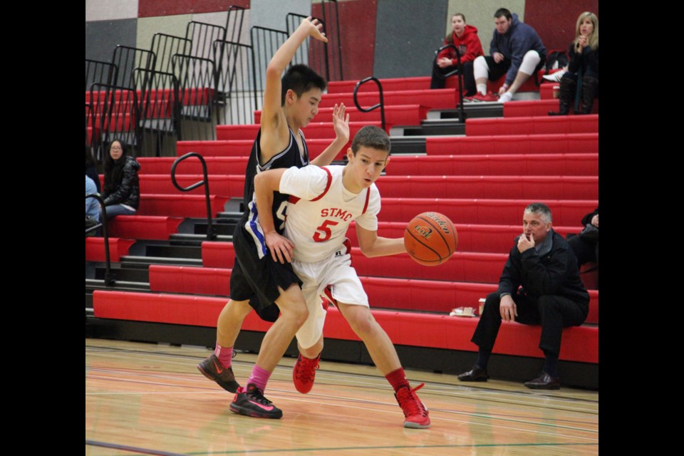 St. Thomas More lost its final game of the B.C. high school junior boys' basketball championships 65-58 to Dover Bay