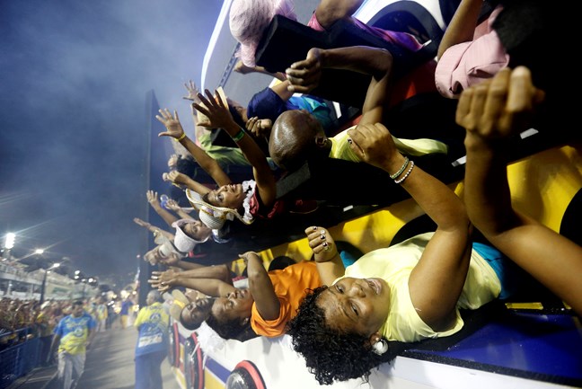 Performers from the Unidos da Tijuca samba school parade during carnival celebrations at the Sambadrome in Rio de Janeiro, Brazil, Tuesday, March 4, 2014. (AP Photo/Silvia Izquierdo)