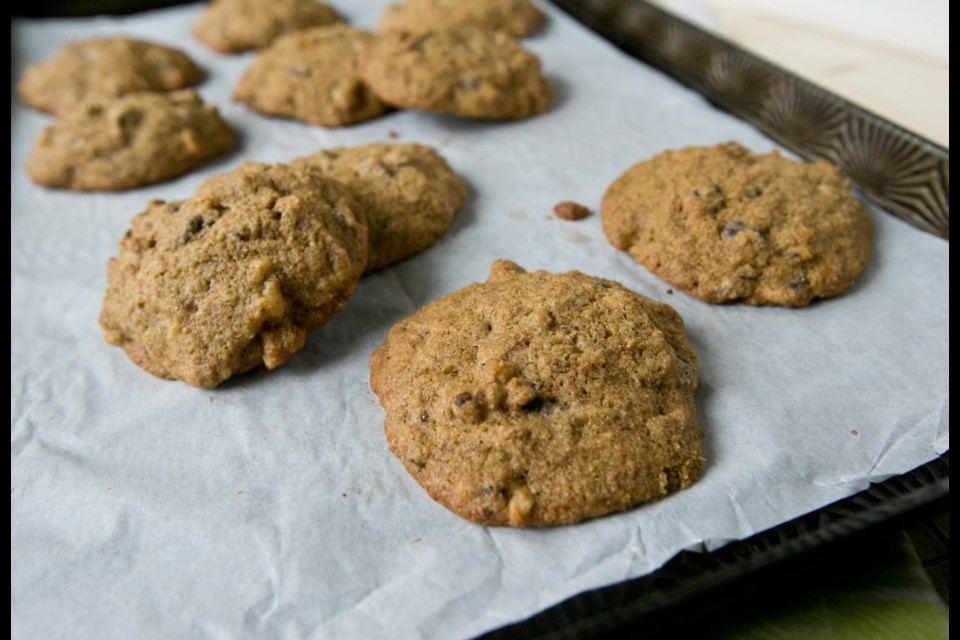 Whole grain flour adds fibre to these cookies baked on sheets lined with heat-resistant parchment paper.