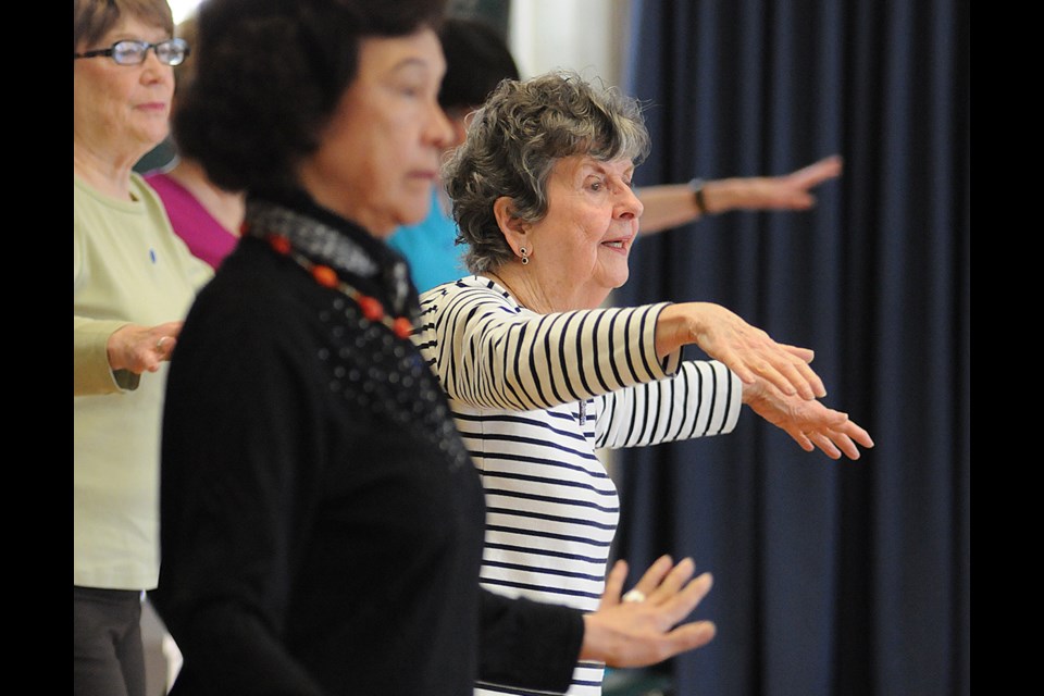 FITTING IN: Maureen Thomson (in stripes) takes part in a Gentle Fit class offered four times a week at the Kerrisdale Senior’s Centre. Photo Dan Toulgoet