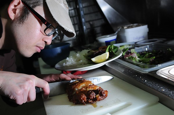 Owner Yamato Takahashi works in the kitchen at Café de L’Orangerie. photo Dan Toulgoet