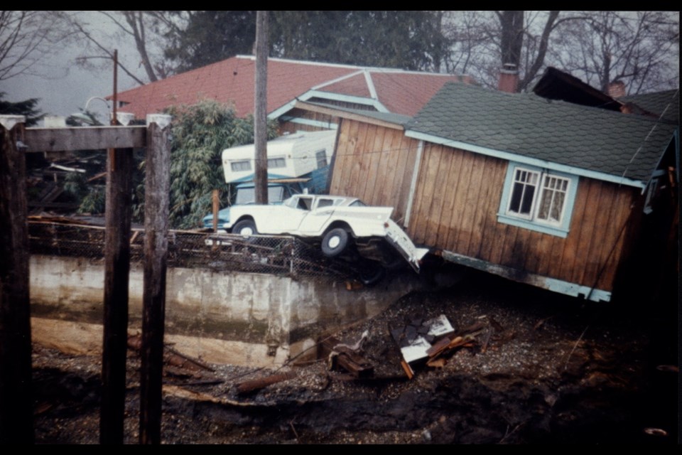 A stranded car, a precariously leaning building and strewn debris are the result of the March 27, 1964 tsunami that roared up Alberni Inlet.