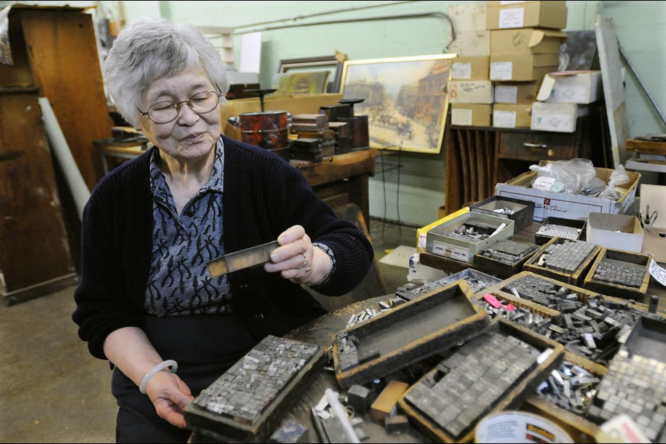 Ho Sung Hing Printers owner Hilda Lam fills a tray with assorted chinese typeset characters to be sold to interested hobbyists. The 104-year-old Chinatown business on East Georgia Street closes its doors for good this Sunday. Photo: Dan Toulgoet