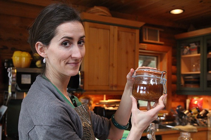 Lisa-Marie Battacharya holds a jar of kefir grains.