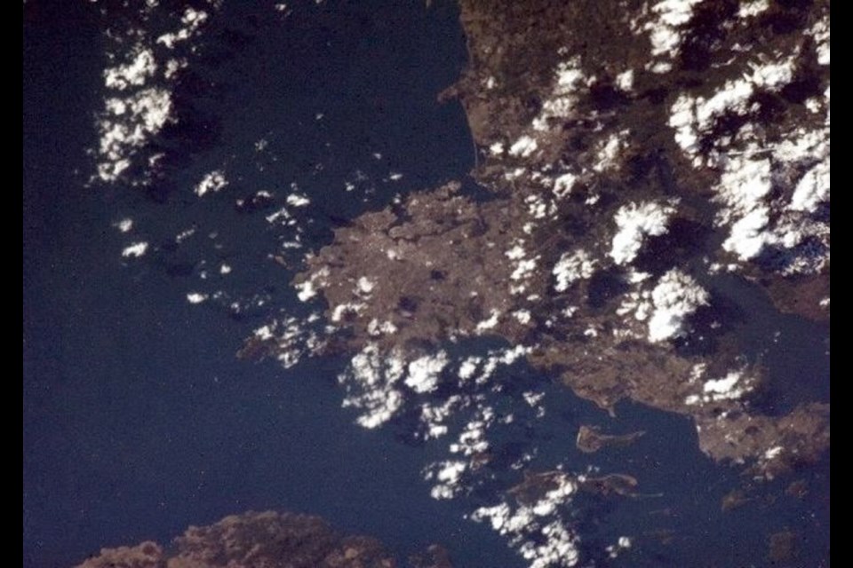 The photo of Greater Victoria taken by astronaut Chris Hadfield. He posted this caption with the photo on Twitter: A few from the West Coast. Here's Victoria, BC. Have tea at the Empress and take time to walk through Butchart Gardens. pic.twitter.com/qldYYptu