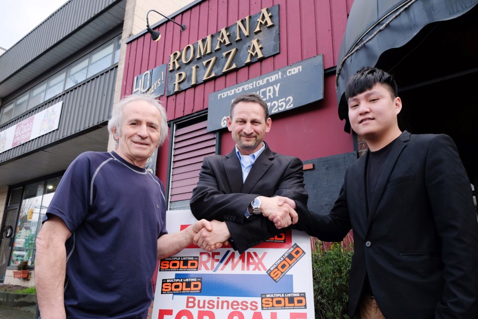 From left to right, Eugene Siormanolakis, former owner of Romana Pizza, realtor Frank Pupo and new owner Calvin Han stand outside the 41-year-old restaurant.