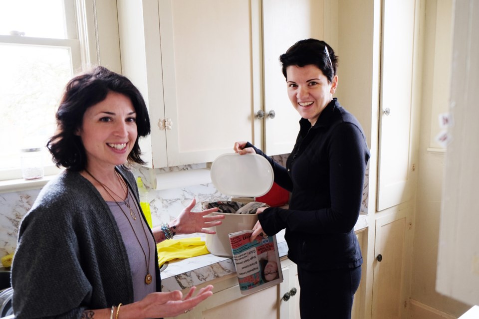 Green coach Jen Casey, left, and homeowner Katie Schiebler are working to make the family's life a "darker shade of green."