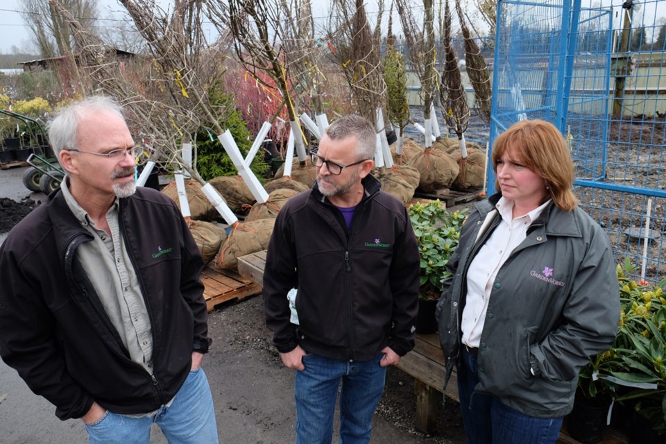 From left, GardenWorks owners Scott Pearce, Peter Fitzmaurice and Leanne Johnson on site at the Mandeville location, which has an infestation of European fire ants along the southern perimeter of the property. The fenced off area behind them has been cleared so that they can pave over the ground, which should help control the invasive ants, which are known to swarm and sting people.