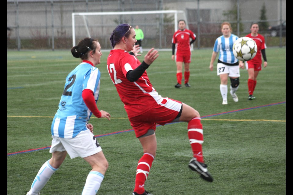 03-30-2014
(red) Burnaby vs. Langley, metro women's soccer.
photo Jason Lang