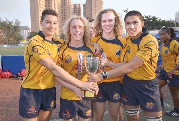 Capilano Rugby Club members Elias Ergas, Cole Keffer, Liam Mahon and Ryan Gray celebrate the victory they earned with the rest of the B.C. U-18 squad at the Hong Kong youth sevens tournament.