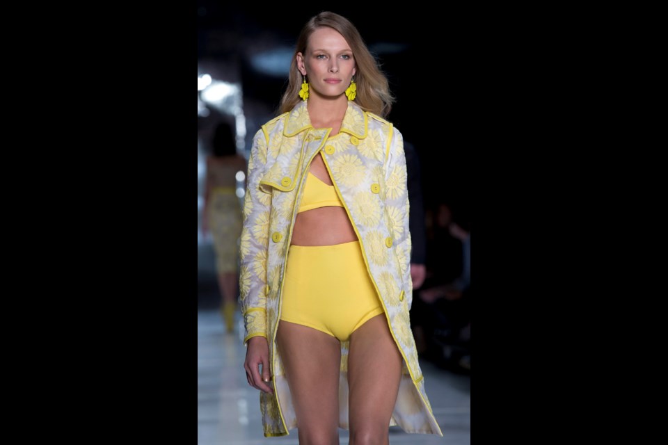 A model wears a creation from the Colcci Summer collection during Sao Paulo Fashion Week in Sao Paulo, Brazil, Wednesday, April 2, 2014. (AP Photo/Andre Penner)