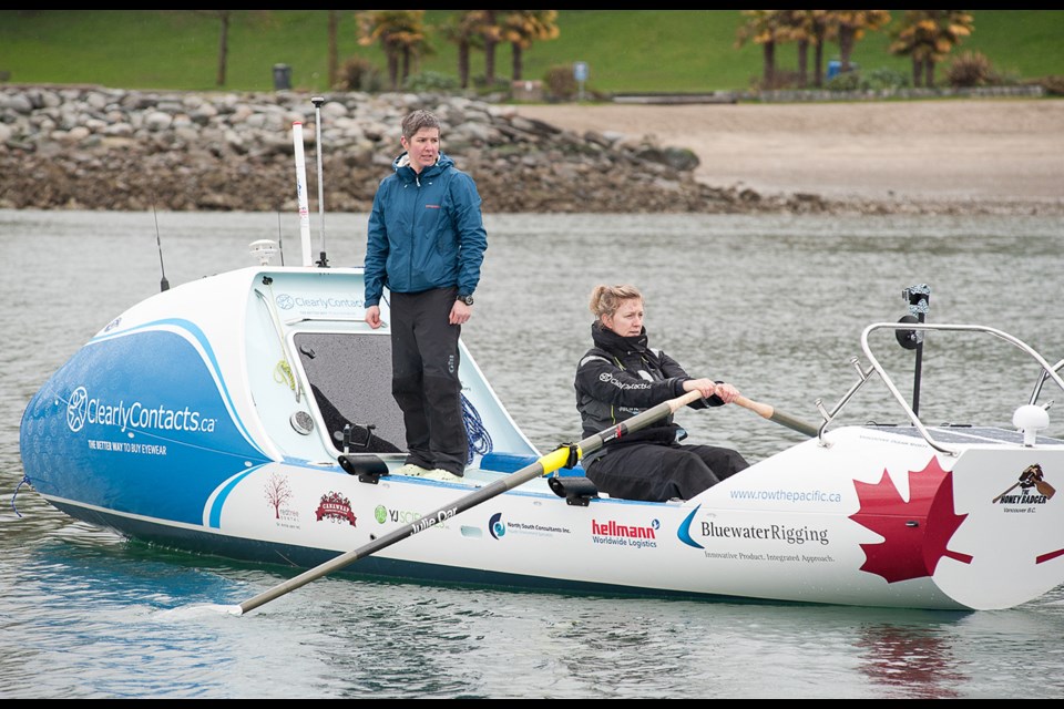 Leanne Zrum (left) and Rebecca Berger take their ocean rower out for a spin after it was equipped with all its technical gadgets. Photo by Rob Newell