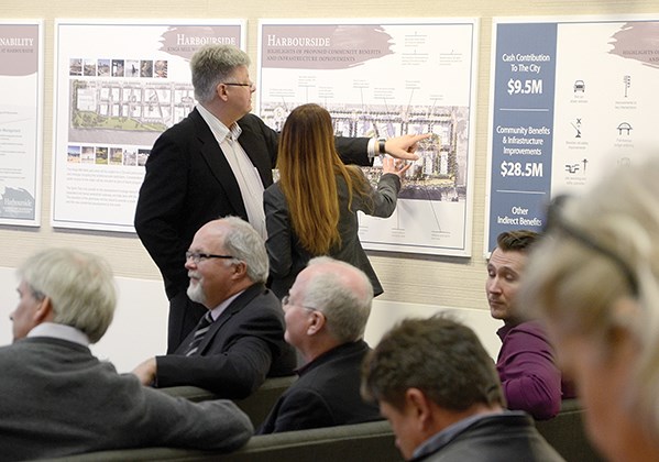 Residents and business owners attend a public hearing in City of North Vancouver council chambers Tuesday to debate rezoning of 801 to 925 Harbourside Dr. for residential properties.