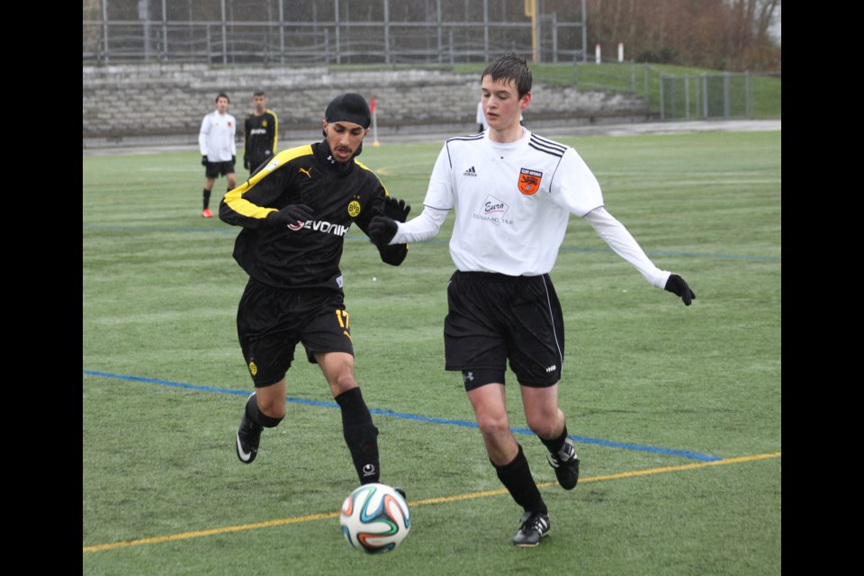 04-05-2014
Cliff Ave (white) vs. Central City, u17 Coastal B Cup quarter final, Burnaby North turf field.
photo Jason Lang