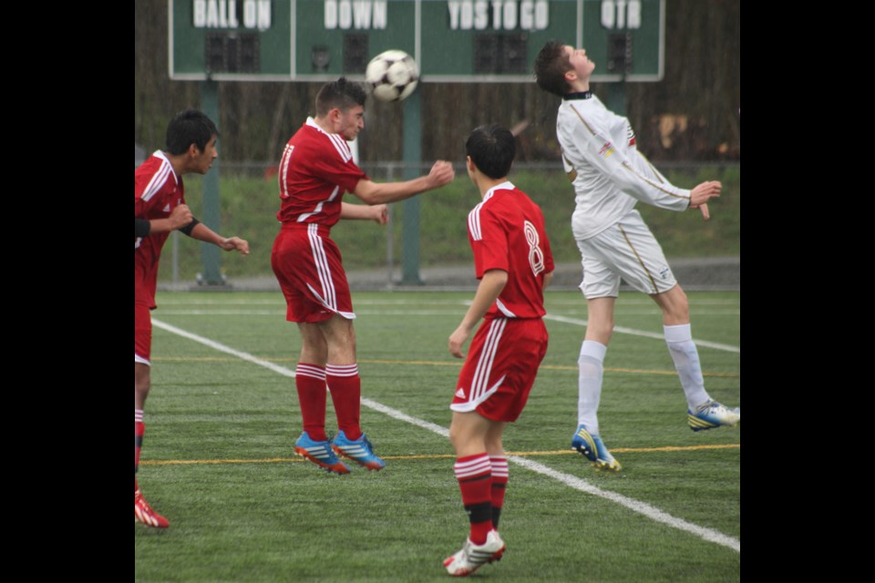04-05-2014
u16 Burnaby Selects (red) vs. Central City Elite, quarter final Coastal A Cup, Burnaby Lake sports complex.
photo Jason Lang