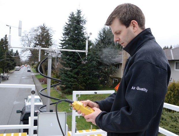 Geoff Doerksen, Metro Vancouver air quality planner, sets up the mobile air monitoring unit, or MAMU, on Second Street in Moodyville. The MAMU will be parked for several months measuring various forms of air pollution coming from Port Metro Vancouver and Low Level Road.