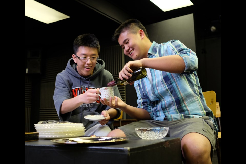 Rumor has it: Howard Dai, left, and Tiger Xu check out some of the newly acquired props for the NWSS production of Neil Simon's Rumors, running May 1 to 3 in the school drama room.