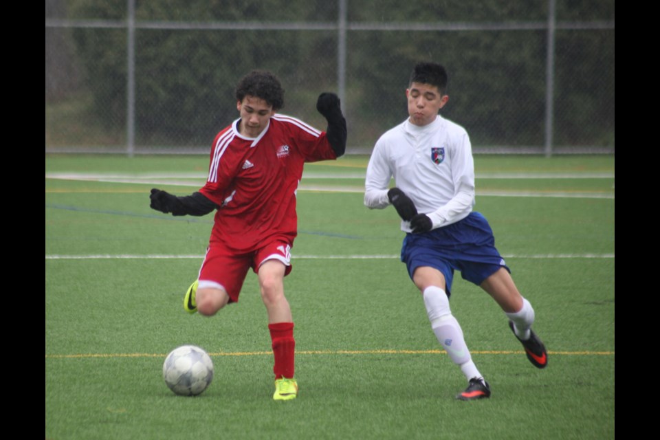 04-05-2014
u 15 Burnaby Selects (red) vs. Delta Coastal Selects, quarter final Coastal A Cup, Burnaby Lake sports complex.
photo Jason Lang