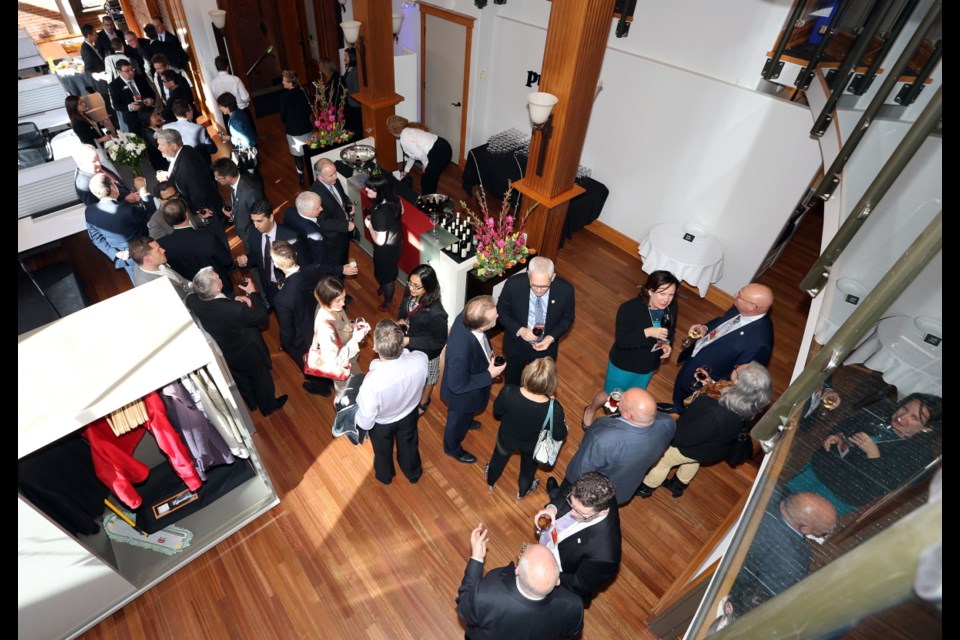 Crowd gathers for the opening of PricewaterhouseCoopers new office in downtown Victoria.