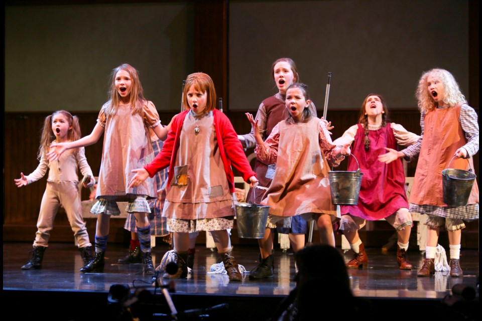 The orphans, led by Julia MacLean (front, in red sweater) as Annie, are a standout of the Royal City Musical Theatre production of Annie.