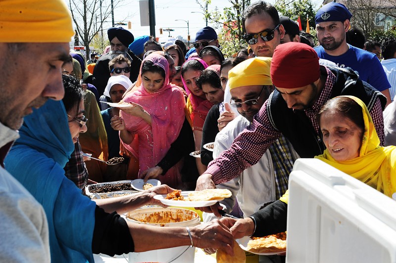 Many homes along the Vaisakhi parade route which went along Marine Drive, up Main Street, down East 49th Avenue, and down Fraser Street back to the Ross Street Temple, offered free vegetarian food for those in attendance. Photograph by: Rebecca Blissett