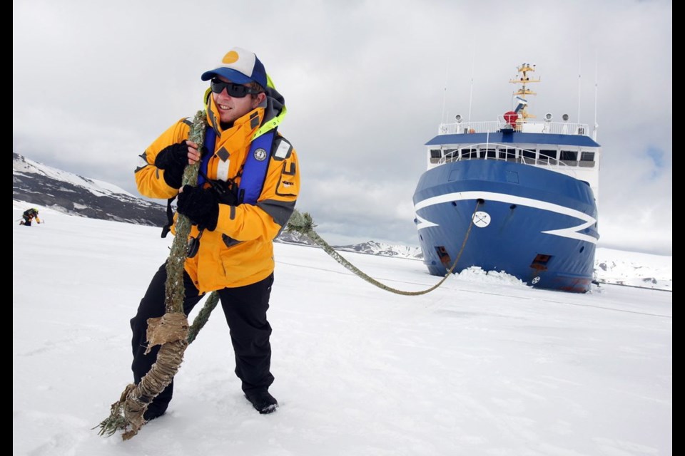 Mike Hann has done a variety of jobs over the past number of years, one of which has been as the underwater leader on a whale research trip to the Antarctic. Here in a moment of levity, Hann tries to drag a ship across the ice.