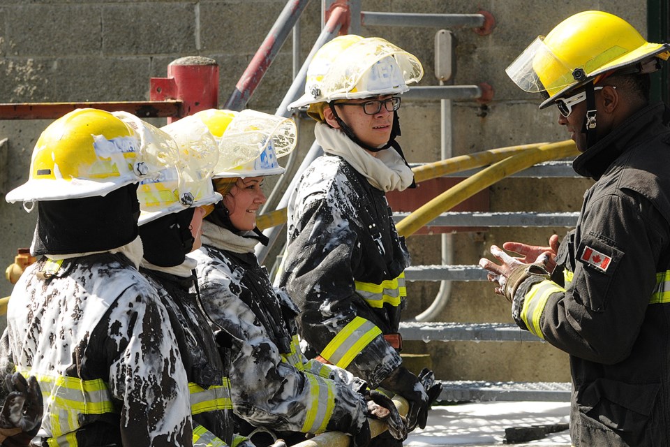 Twenty-four high school students wrapped up an intense week of firefighting boot camp at Vancouver Fire and Rescue Services’ training centre. Students attended a grueling five-day Youth Outreach Academy program where they acquired firefighting skills, first aid, search and rescue techniques and hands-on use of the “jaws of life.” Photos Dan Toulgoet