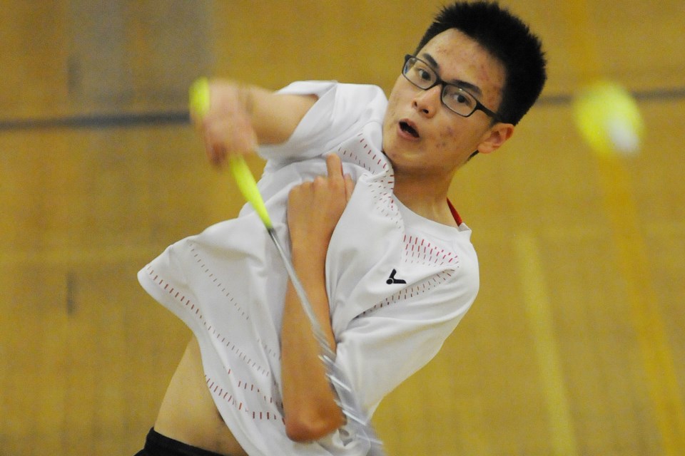 Killarney’s Juan Karamoy returns a shot in a boys doubles match at Killarney April 16, 2014.