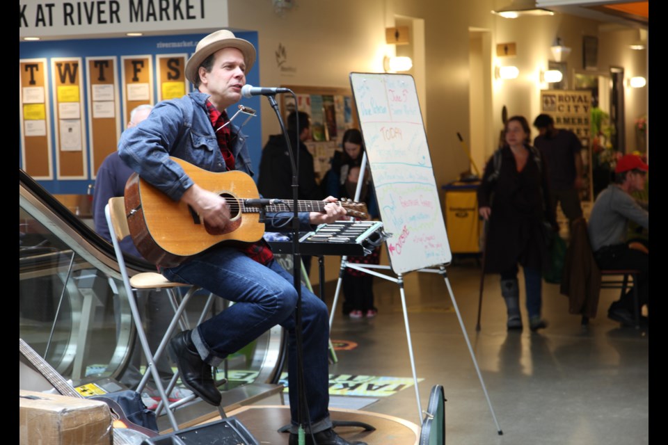 David Paterson performs for the last indoor farmers' market of the season, held at River Market on April 19. The Royal City Farmers Market moves outdoors to Tipperary Park starting in June.