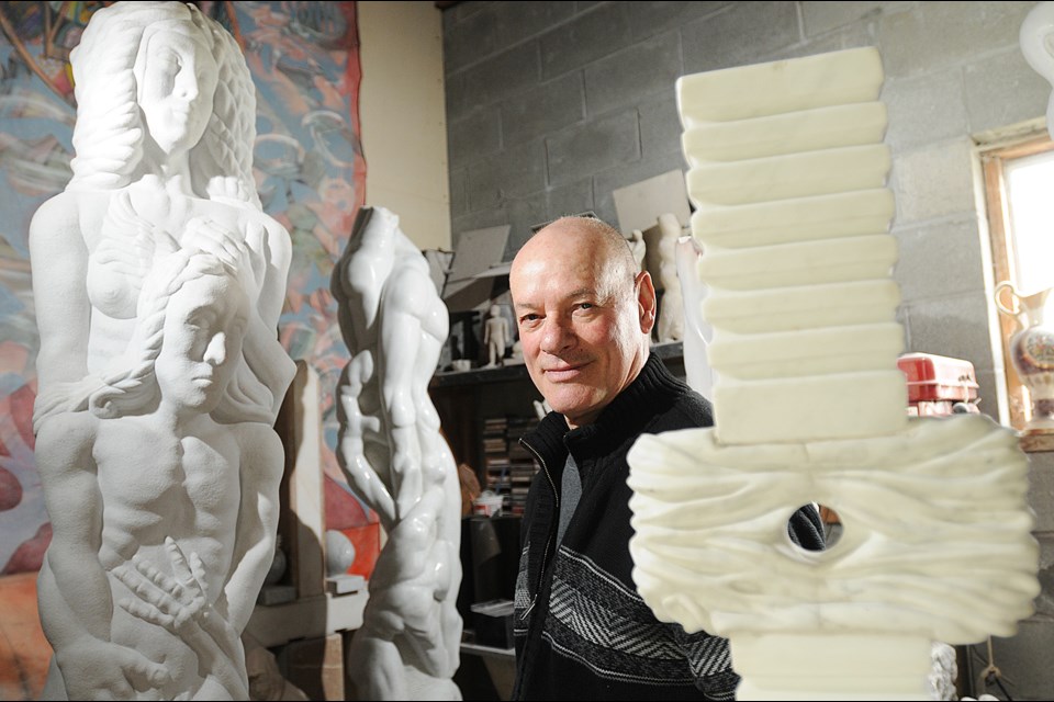 Lorenzo De Francesco strikes a pose amongst his sculptures. Photo Dan Toulgoet