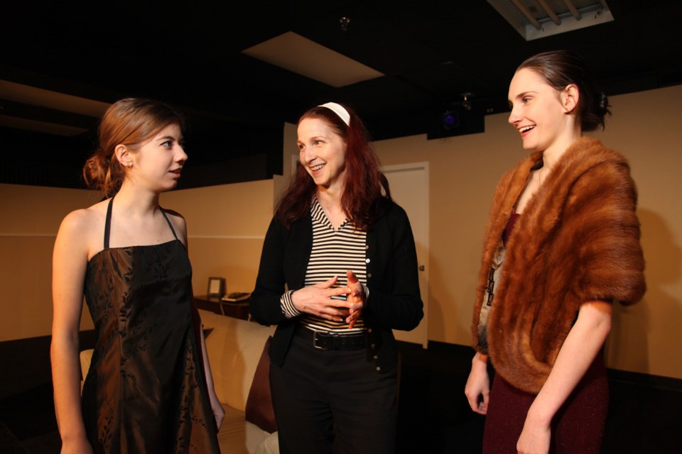 Director Renee Bucciarelli, centre, works with student actors Diana Smith and Courtney Jacobsen on the NWSS production of Rumors, onstage in the drama room this week.