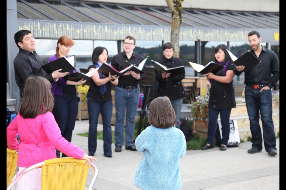 Singers from VanDeca entertained shoppers and passersby at River Market on Sunday.