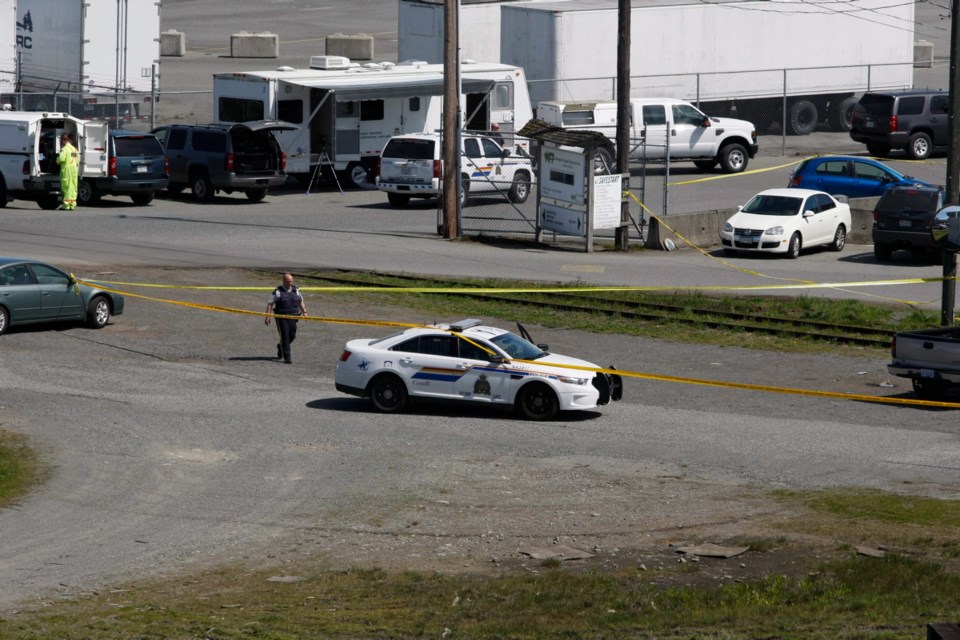 RCMP block off an area at Western Forest Products mill in Nanaimo, B.C., on Wednesday April 30, 2014. The company that owns a lumber mill on Vancouver Island says the 47-year-old suspect in a shooting of four people is a former employee of the mill. Two men are dead and two other men are in hospital after the shooting at the Western Forest Products sawmill in Nanaimo.