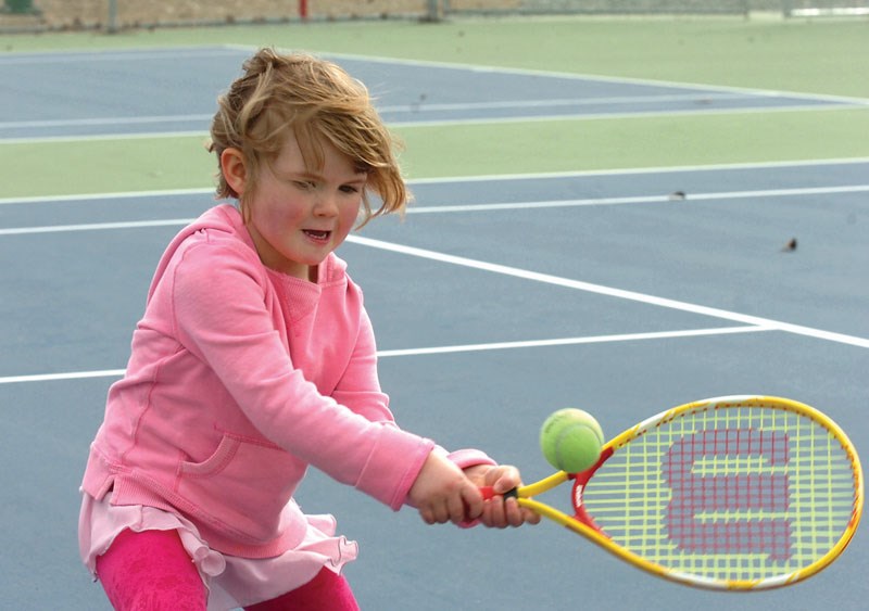 Lauryn Walsh, 4, smacks the ball Saturday at the new Prince George Tennis Courts annual open house. Citizen photo by David Mah