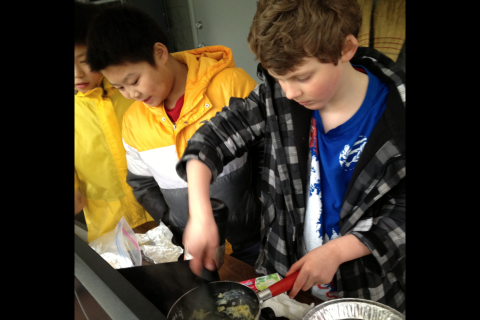 Besides outdoor activities, kids at Scout Camp learn practical skills such as cooking. photo submitted
