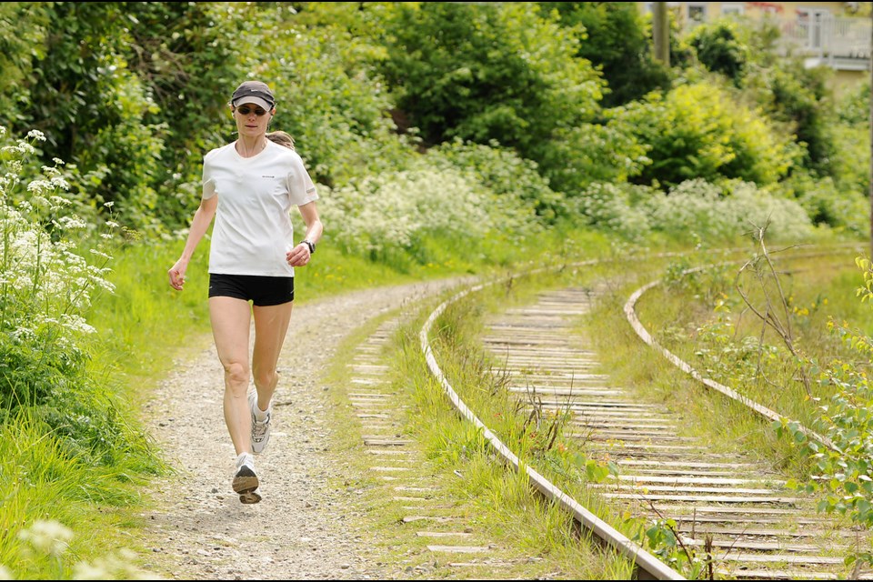 A jogger uses the Arbutus Corridor near the S curve. Photo: Dan Toulgoet