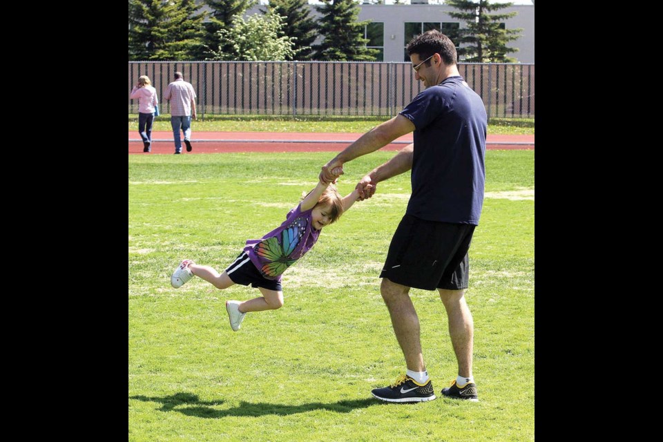 Brian Merriman and his daughter Alana, 3, had fun spinning around in Masich Place Stadium.
Jun 4. 2012
Citizen photo by David Mah