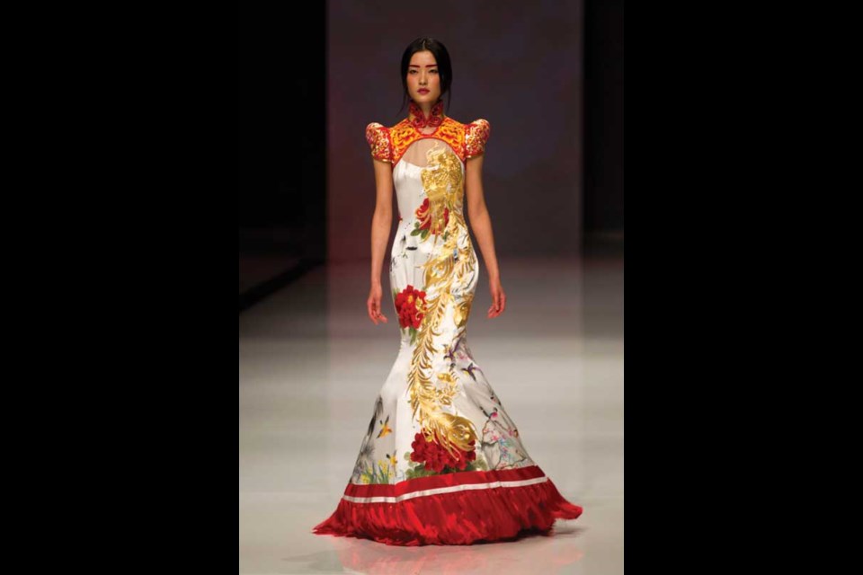 A model presents a creation by NE TIGER at a fashion show during the China Fashion Week in Beijing, Thursday, Oct. 25, 2012. (AP Photo/Alexander F. Yuan)
