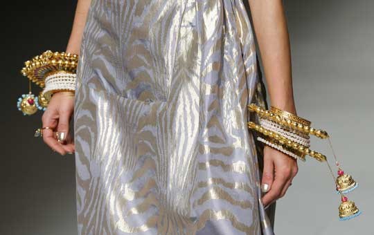 A model wears a creation for Indian fashion designer Manish Arora's ready to wear Spring-Summer 2013 collection, presented in Paris, Thursday, Sept.27, 2012. (AP Photo/Jacques Brinon)