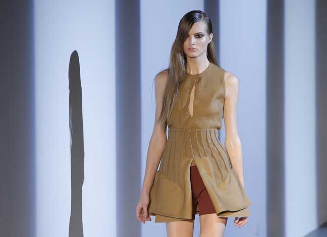 A model wears a creation as part of fashion designer Nicola Formichetti and Sebastien Teigne for Thierry Mugler's spring-summer 2013 ready to wear collection in Paris, Wednesday, Sept. 26, 2012. (AP Photo/Francois Mori)