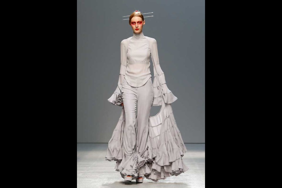 A model wears a creation by British fashion designer Gareth Pugh for fashion house's Spring Summer 2013 ready to wear collection, for Fashion Week, in Paris, Wednesday, Sept.26, 2012.(AP Photo/Jacques Brinon)