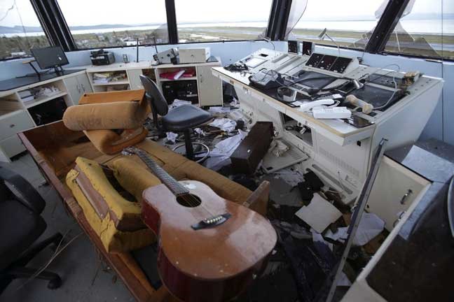 The remains of an airport control tower are seen after powerful Typhoon Haiyan slammed into Tacloban city, Leyte province central Philippines on Saturday, Nov. 9, 2013. Rescuers in the central Philippines counted at least 100 people dead and many more injured Saturday, a day after one of the most powerful typhoons on record ripped through the region, wiping away buildings and leveling seaside homes with massive storm surges. (AP Photo/Aaron Favila)