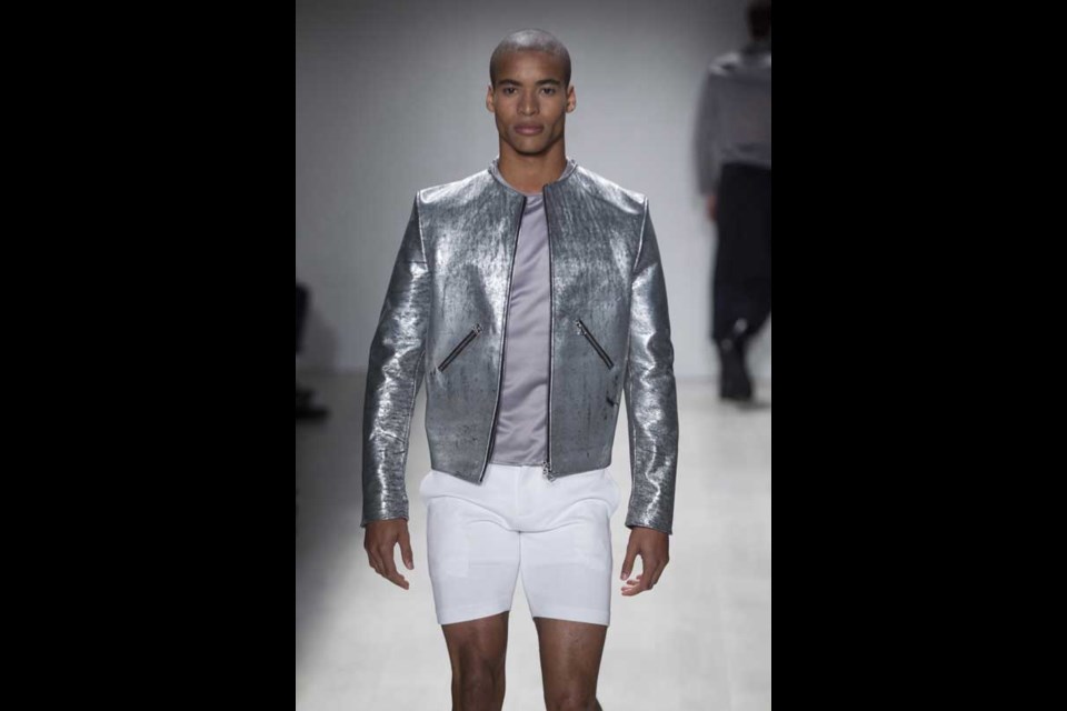 A model wears a creation from Axel K while walking the runway during Toronto Fashion Week in Toronto on Wednesday October 23, 2013. THE CANADIAN PRESS/Chris Young