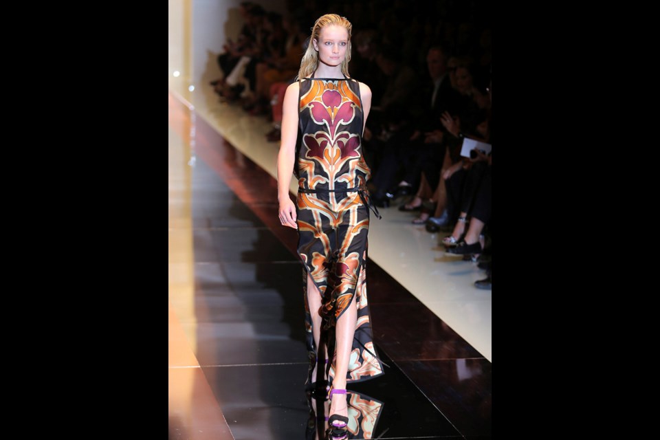 A model wears a creation for Gucci women's Spring-Summer 2014 collection, part of the Milan Fashion Week, unveiled in Milan, Italy, Wednesday, Sept. 18, 2013. (AP Photo/Antonio Calanni)